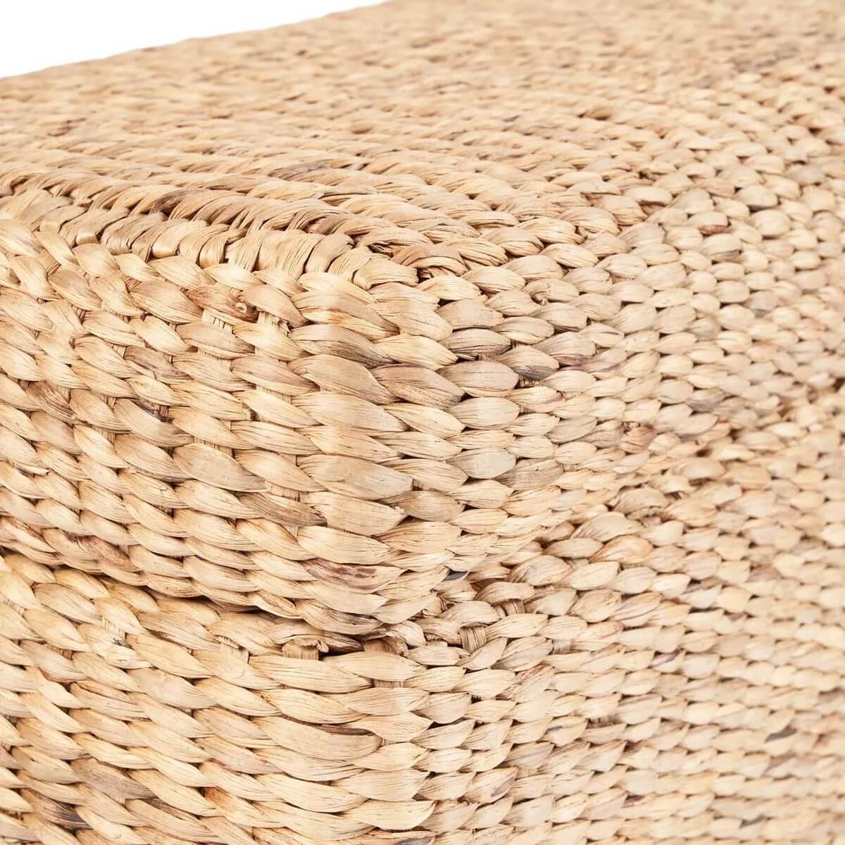 Close-up of De Big Sure Storage Ottoman in natural woven water hyacinth, perfect for Bohemian style and practical storage.