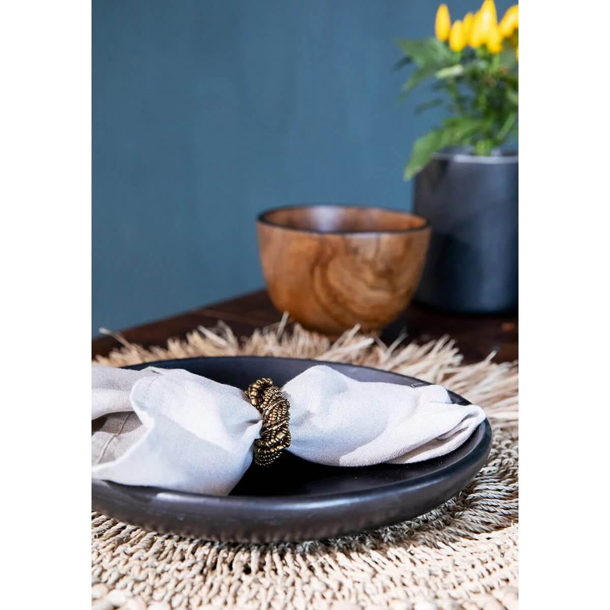 Bohemian De Bondi Candy Bowl with a natural teak design, ideal for storing accessories or serving dry snacks, on a stylish table setting.