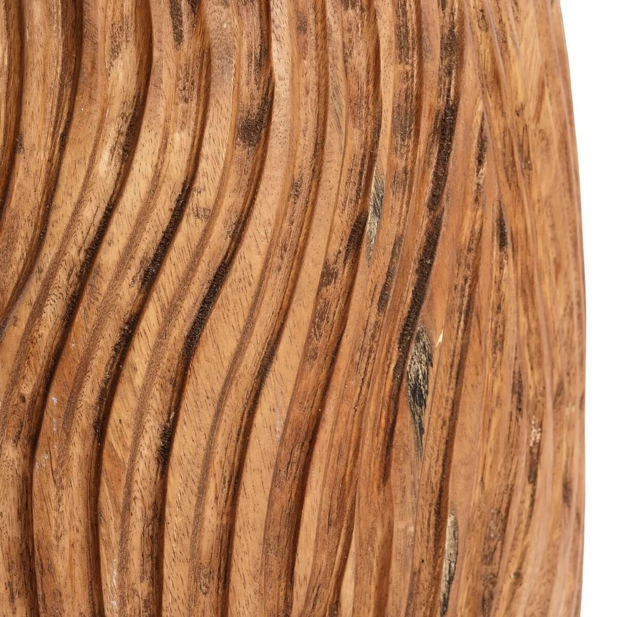Close-up of the carved wooden texture of the Bohemian Celebes Stool in natural suar wood with tree ring pattern detailing.
