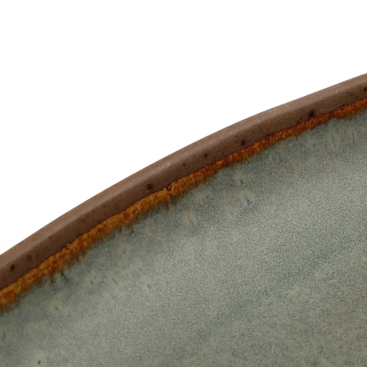 Close-up of handcrafted Portuguese ceramic serve platter with unique design and natural color variations.