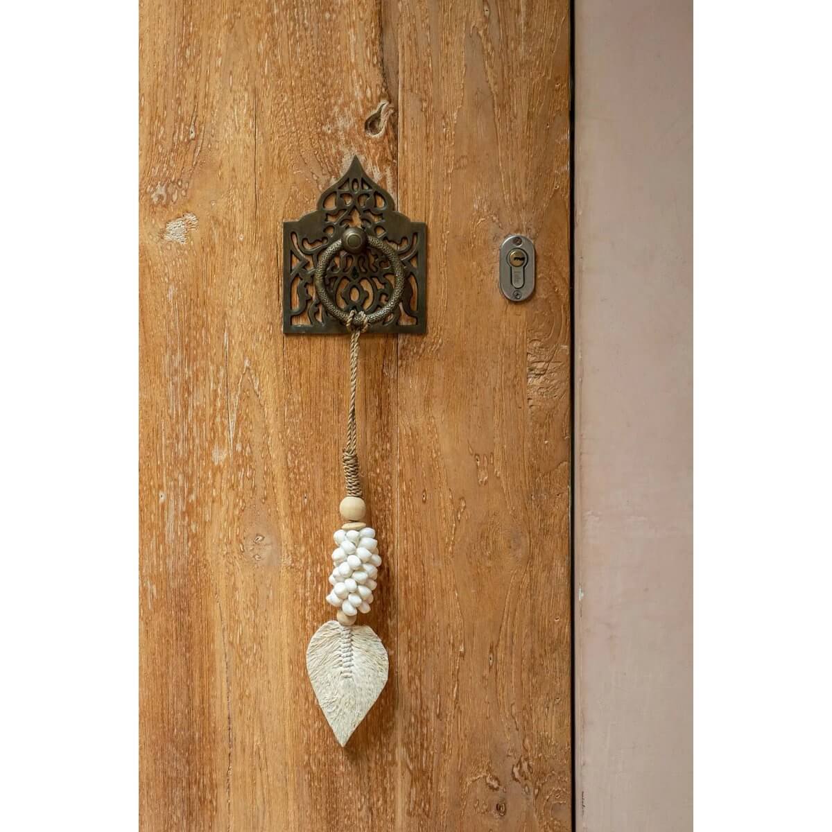 Bohemian white shell door tassel by Bazar Bizar Living, handcrafted by Balinese artisans, adding exotic charm to home decor.
