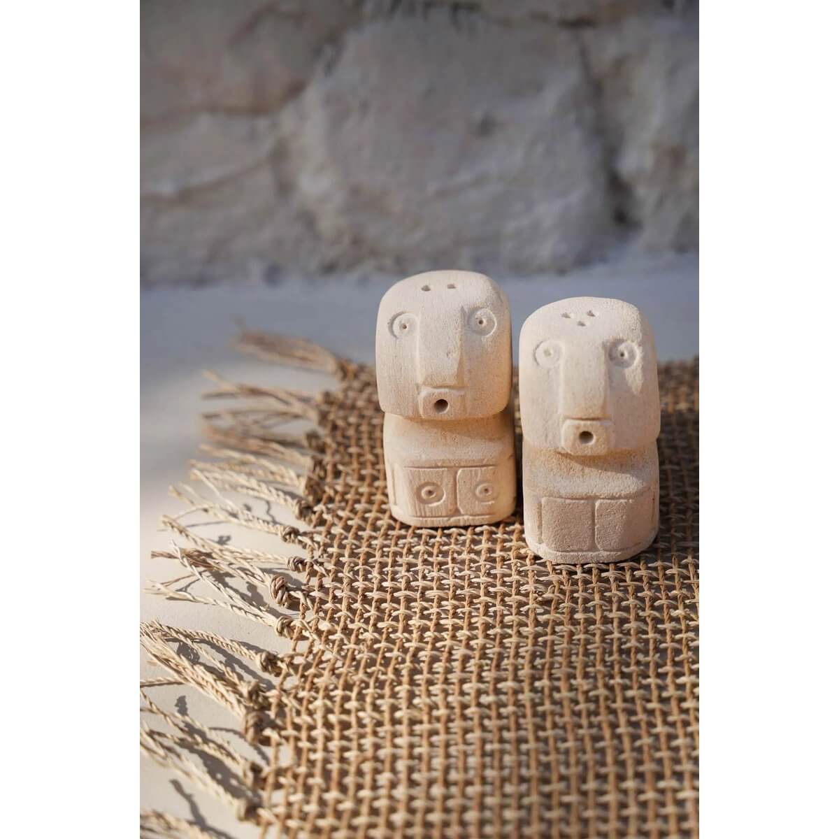 Bohemian Salt & Pepper Sumba set, featuring two sandstone shakers shaped like charming stone figures, adding elegance to your table.