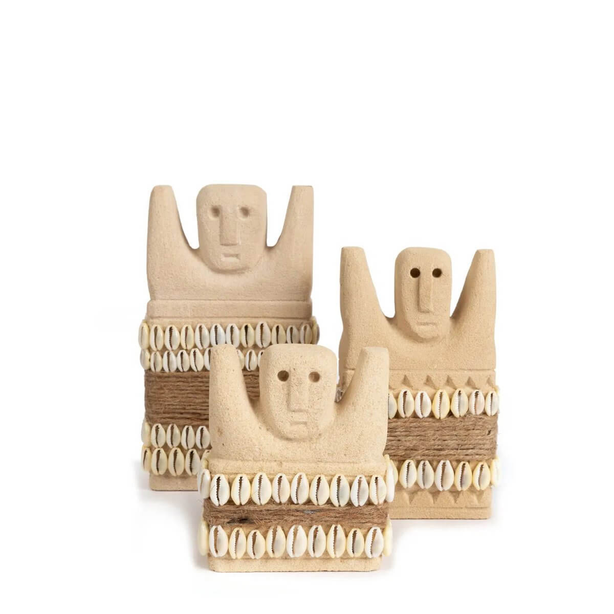 Handcrafted Sumba stone statues with shell decoration from Indonesia, perfect for a bohemian home decor vibe and cultural protection.