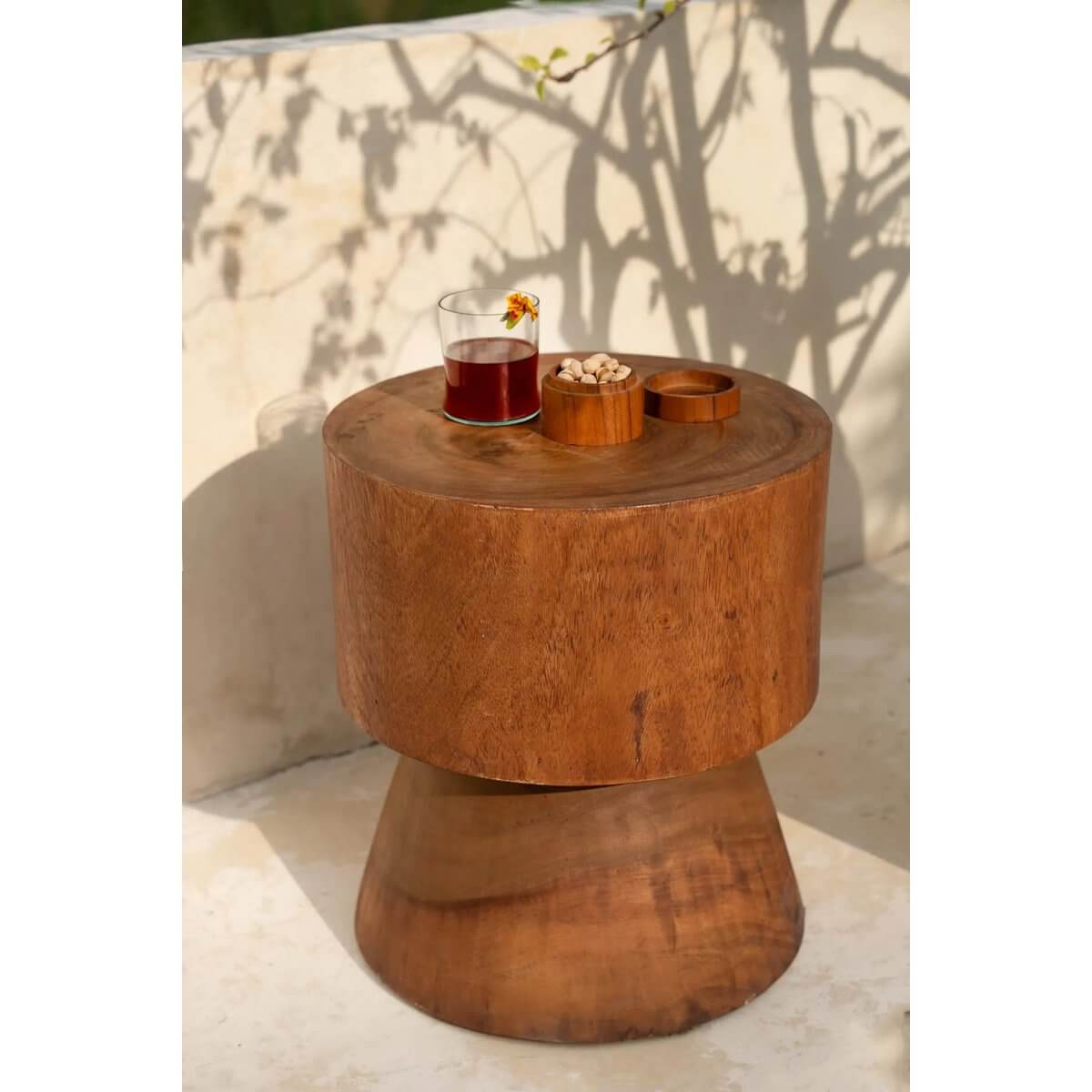 Bohemian teakwood pot with organic contours, perfect for versatile storage and adding rustic charm to any table setting.
