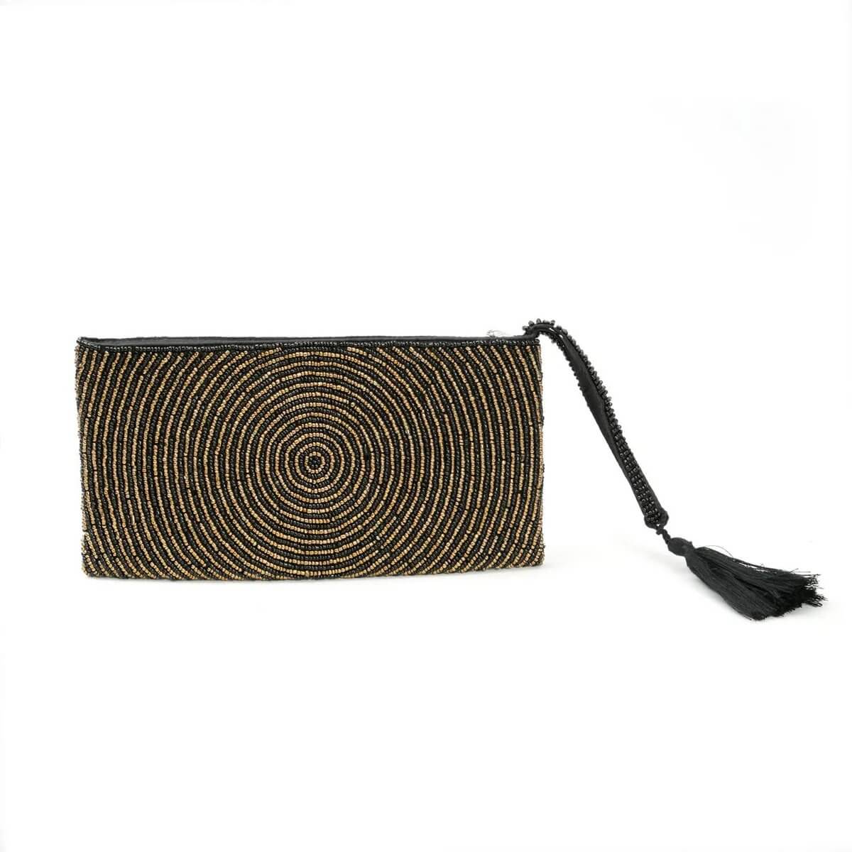 Bohemian golden clutch with circular bead design and tassel, blending style with function for magical adventures.