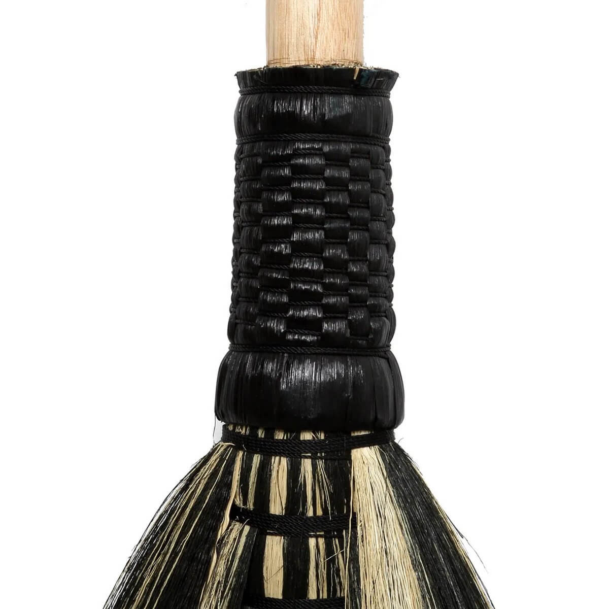 Stylish Bohemian black Indonesian grass broom handle from Bazar Bizar Living; decorative home accent.