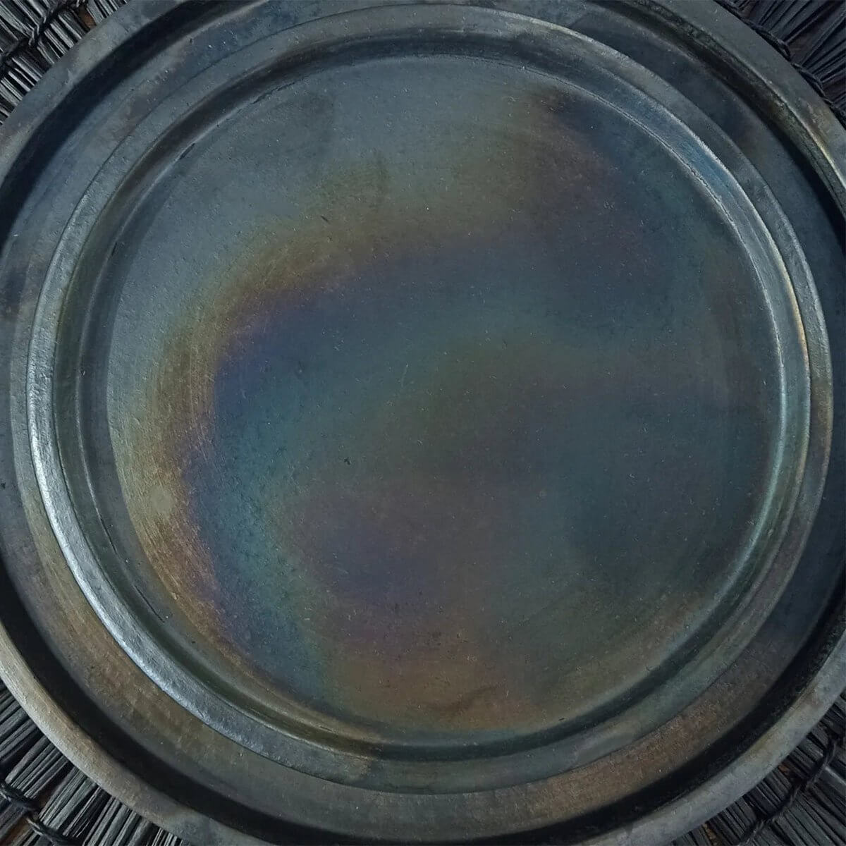 Black Bohemian-style burnt ceramic plate by Bazar Bizar Living, perfect for a stylish table setting, 30cm wide.