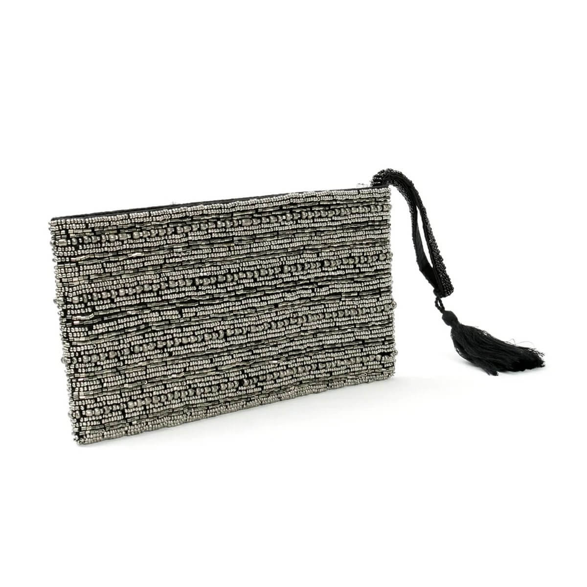 Chic bohemian silver clutch with tassel, perfect for dazzling style and compact storage.