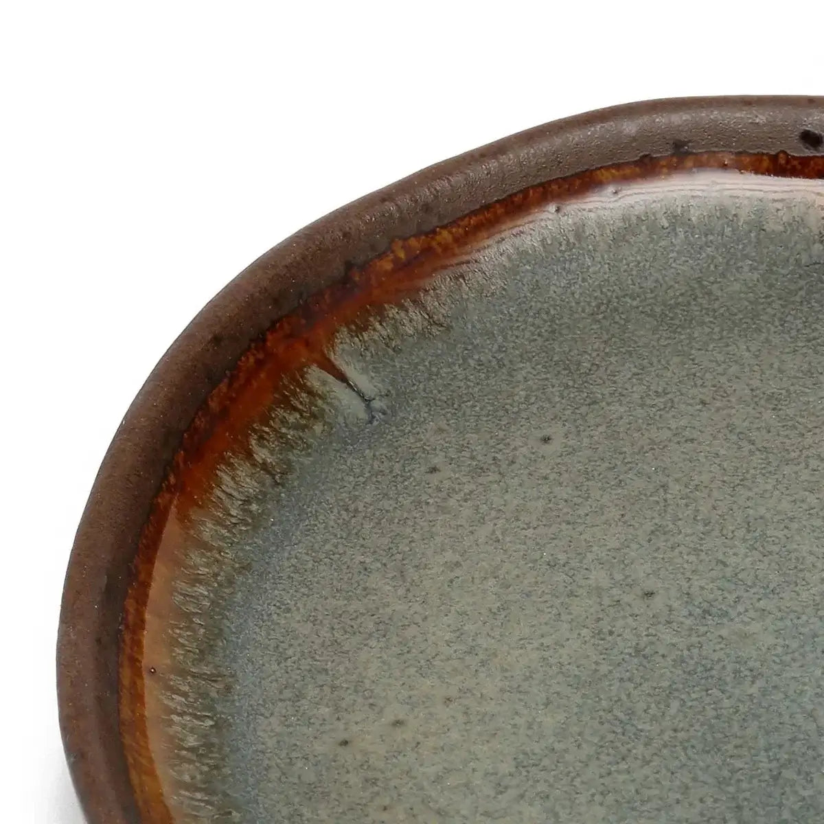 Handmade Portuguese ceramic appetizer plate, close-up view. Elegant design, perfect for enhancing any dining experience.