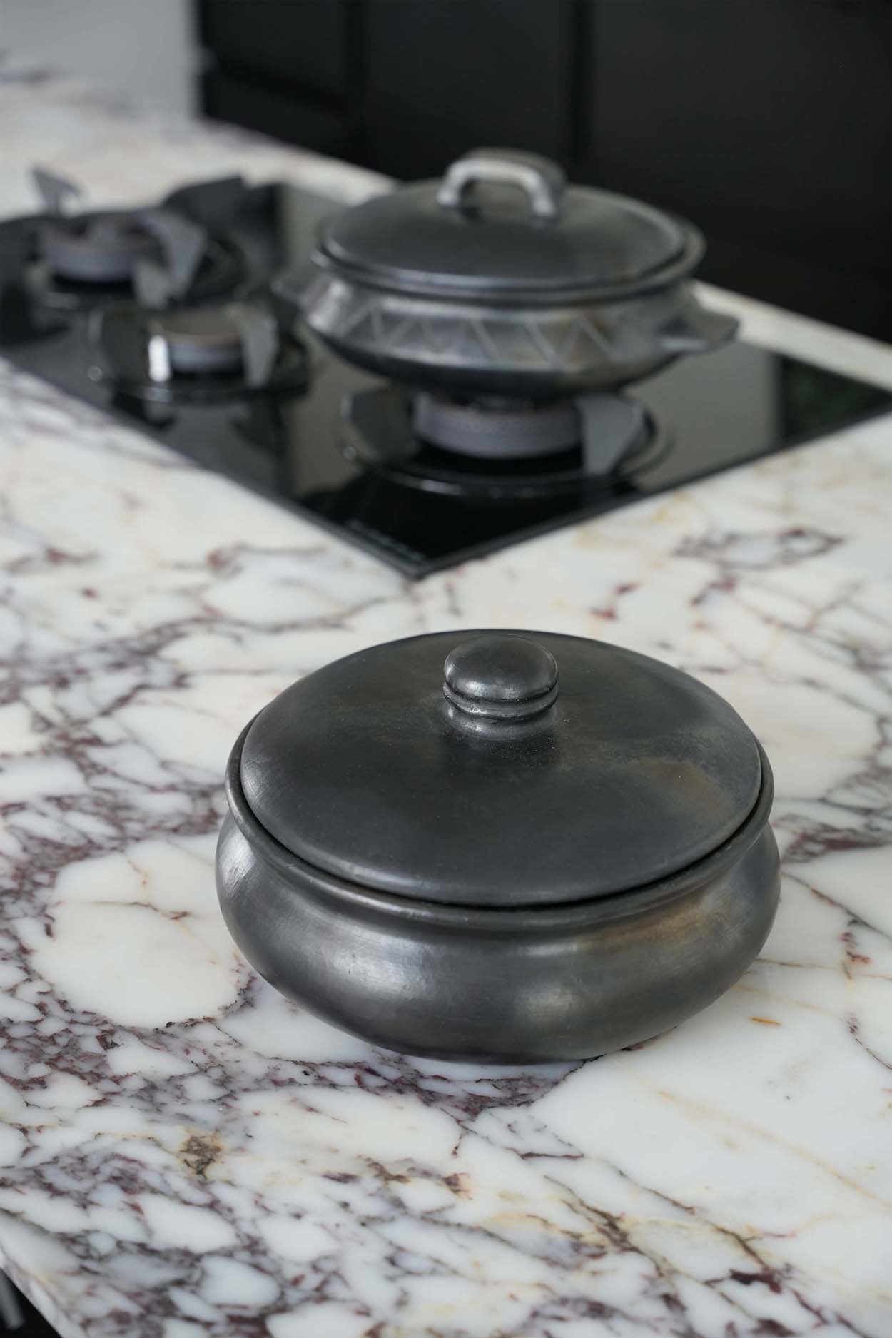 De Burned Curry Pot - Zwart