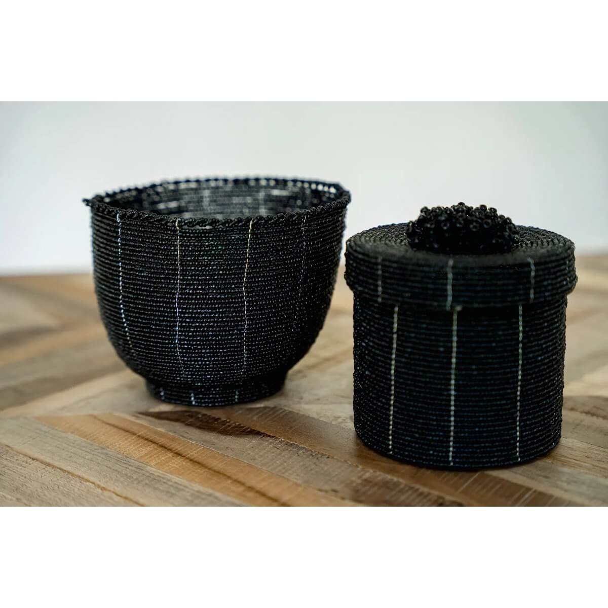 Handmade black beaded candy bowl set on a wooden table, perfect for Bohemian decor and storage in any room.