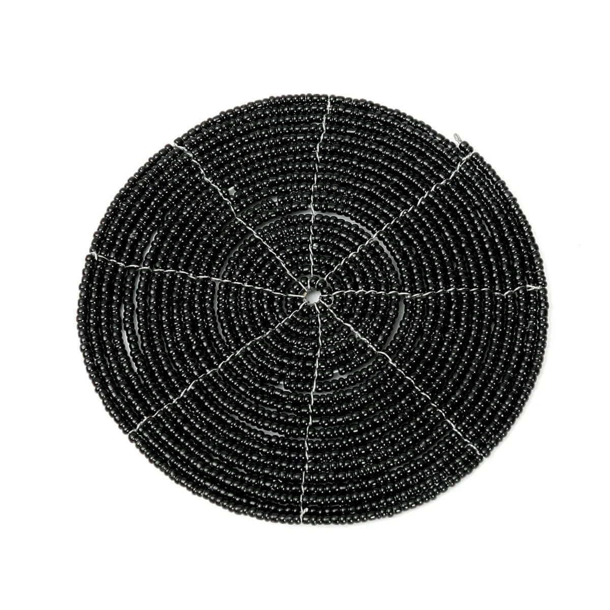 The Beaded Coaster in black, perfect for a Bohemian table setting, 10cm wide by Bazar Bizar Living.