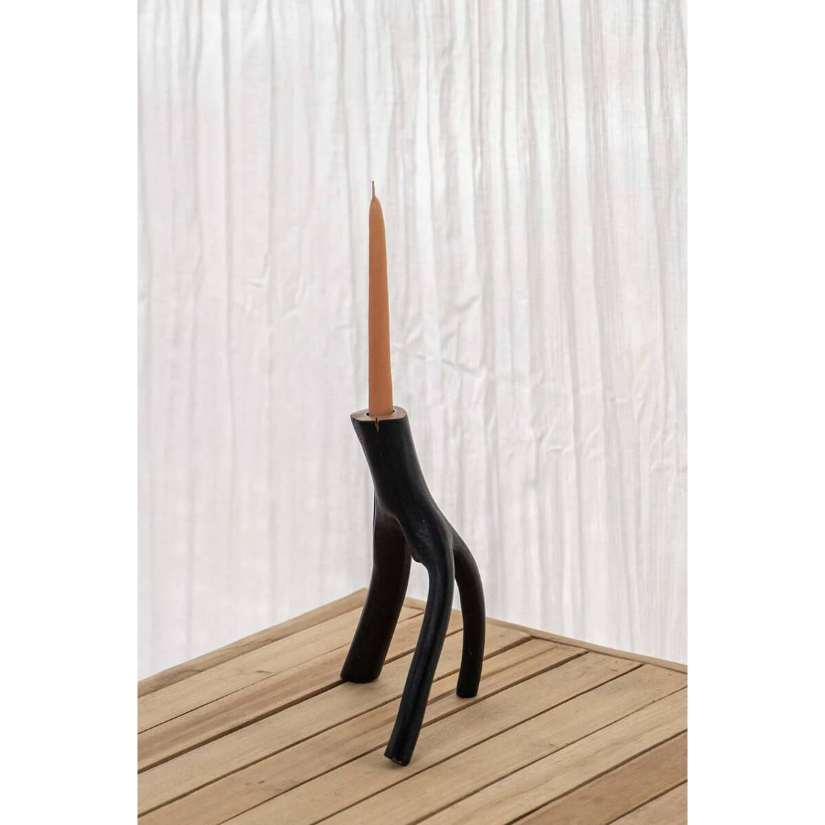 The Triple Twig Candle Holder in black metal, featuring an organic design, perfect for a Bohemian home decor ambiance.