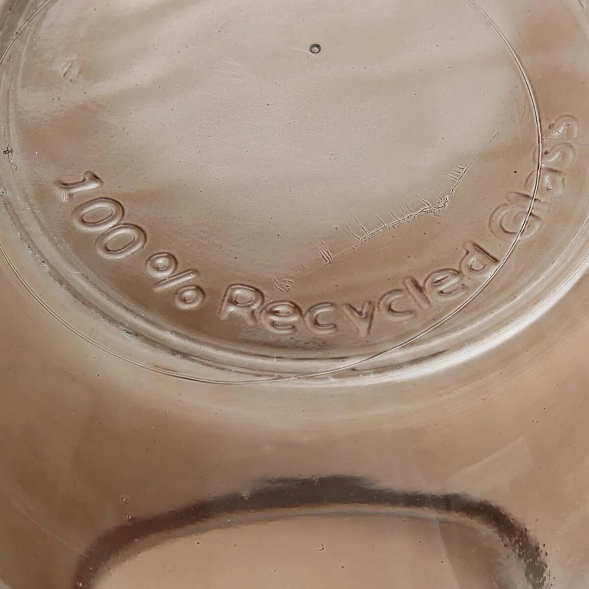 Close-up of a vase made from 100% recycled glass, perfect for a Bohemian decor style, emphasizing sustainability and modern design.