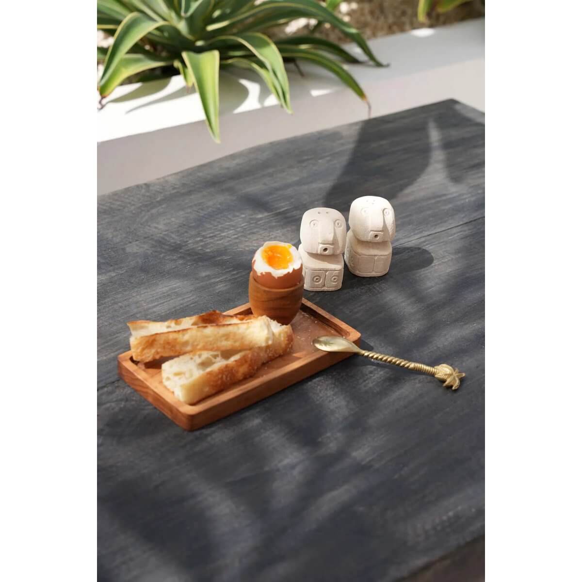 Bohemian breakfast scene with Goud De Ananas Theelepel, a luxurious pineapple-themed brass spoon, next to toast and egg.