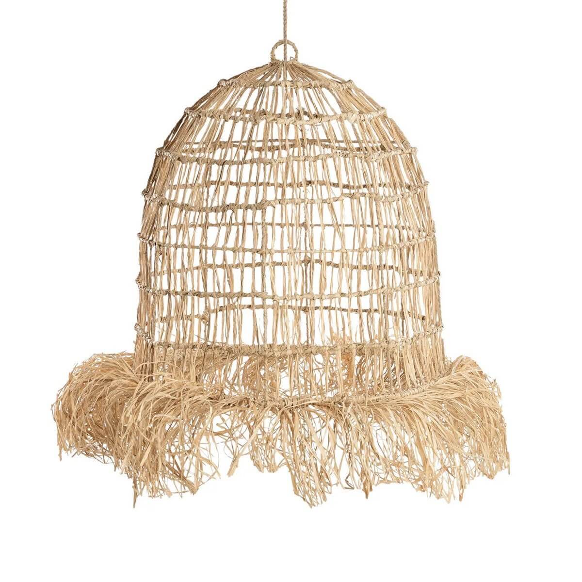 Handmade Bohemian Casita hanging lamp in natural mendong grass with fringe, creating tropical light patterns for a paradise vibe.