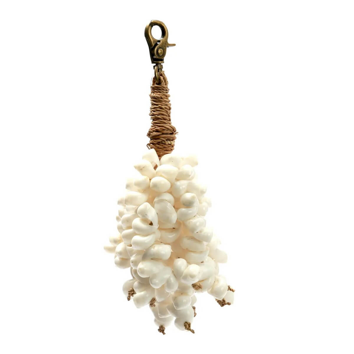 Bohemian De Kai shell keychain with cascading white cowrie shells and cotton tassels, adding coastal elegance to your essentials.