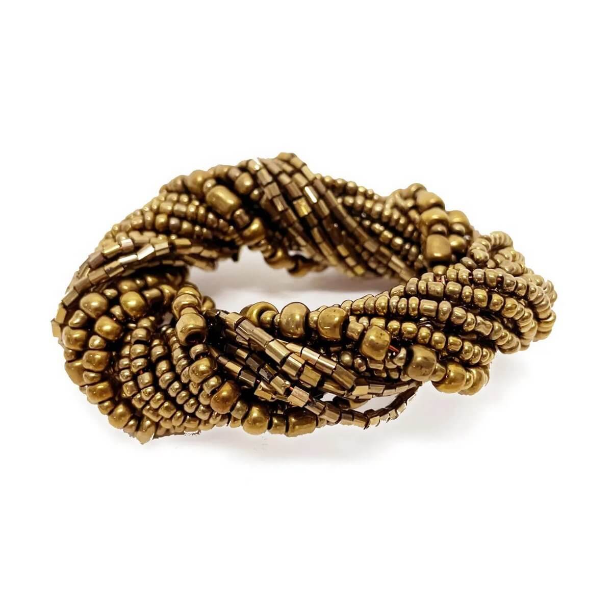 Bohemian beaded napkin ring in gold, set of 4; adds elegance and style to dining table decor. Perfect for special occasions.