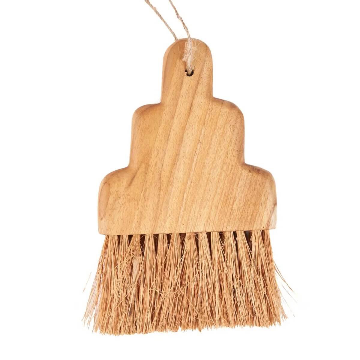 Bohemian-style De Osta Brush in teak with strong bristles for crumbs and dirt, featuring a sleek handle for comfortable grip.