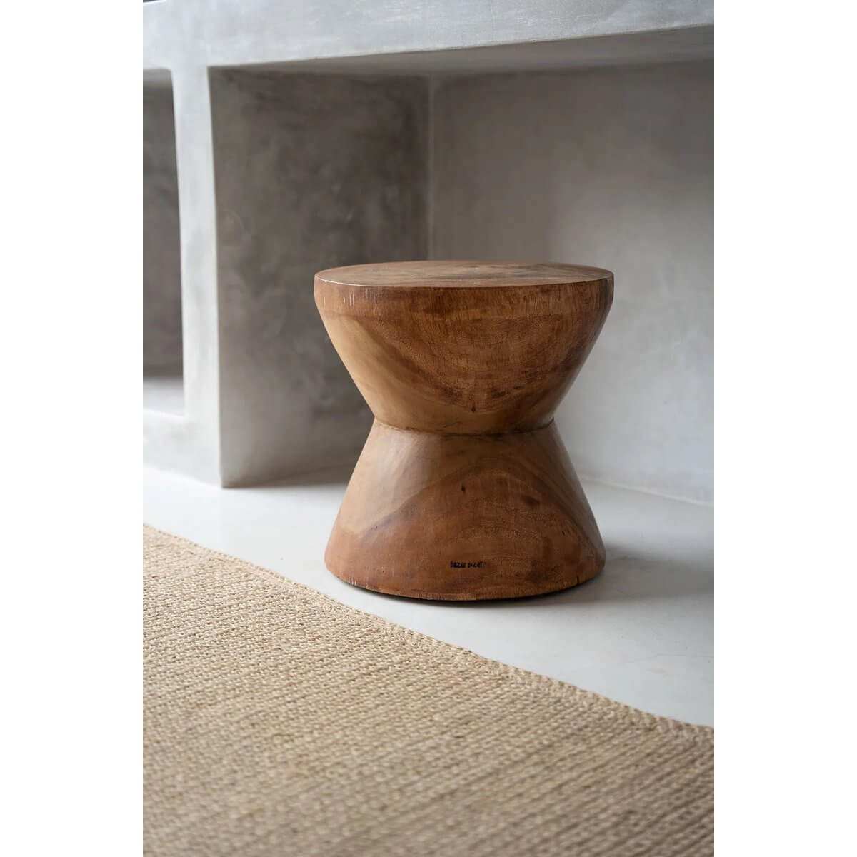 Bohemian style Pacha Mama stool in natural suar wood finish, showcasing organic design and versatility as a side table.