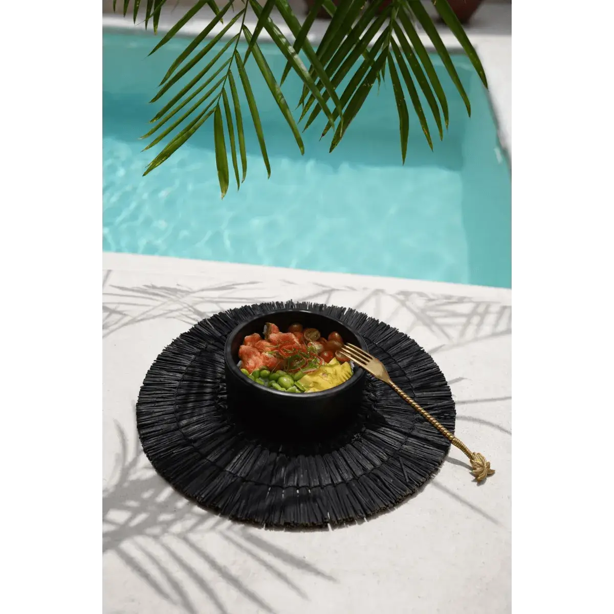 Poolside salad bowl with gold palm tree fork, tropical vibes, bohemian luxury dining in the sun.