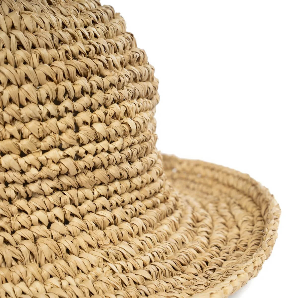 Close-up of a Bohemian Pantai straw hat, crafted from natural sea grass and shells, perfect for stylish beach outings.