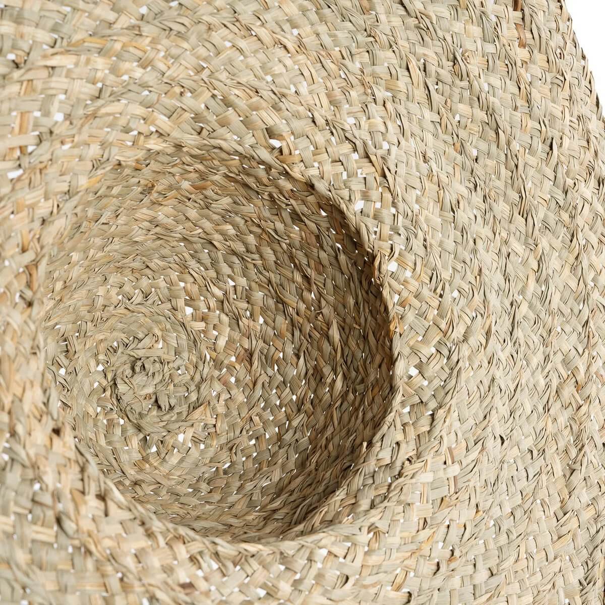 Close-up of a woven Bohemian-style Playa Hat made from natural water hyacinth, showcasing its intricate beige weaving by Bazar Bizar Living.