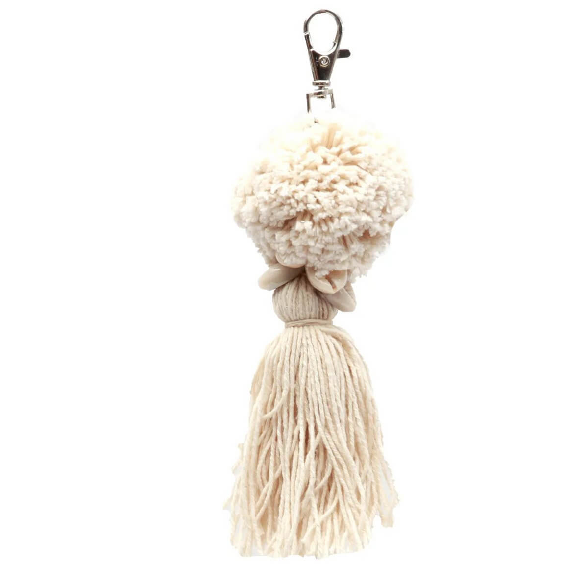 Bohemian white cotton pom-pom keychain with soft texture, perfect for keys or bags. Lightweight accessory for a playful, stylish touch.