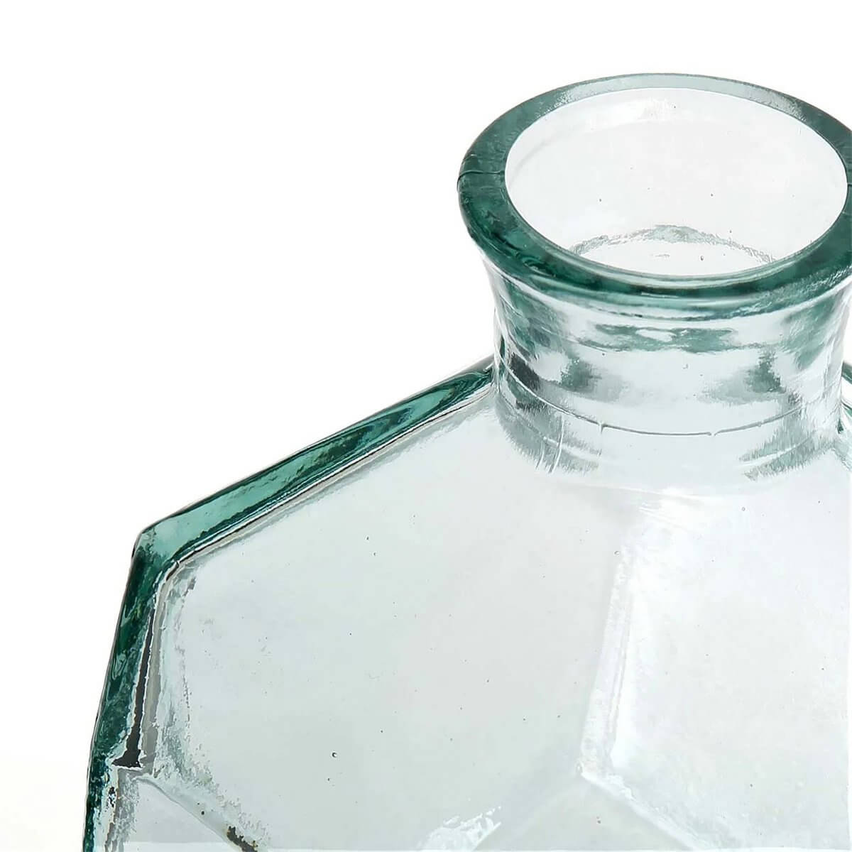 Close-up of transparent glass vase with geometric design, showcasing a modern Bohemian style.