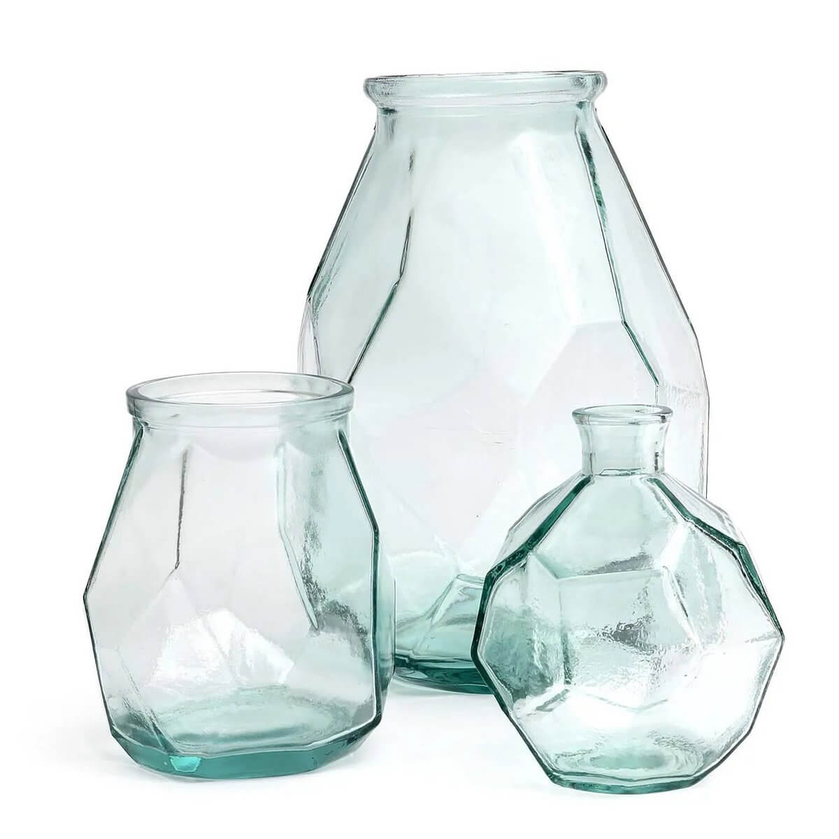 Three glass vases with faceted, geometric designs, showcasing a modern Bohemian aesthetic. Perfect for stylish home decor displays.