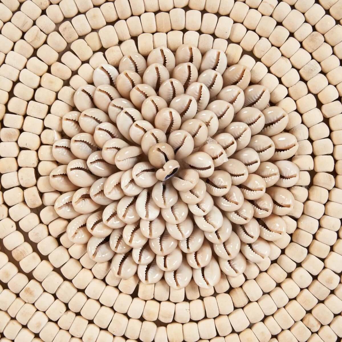 Elegant shell design pattern on Shell Martinique, showcasing natural white shells in a circular arrangement for home decor charm.