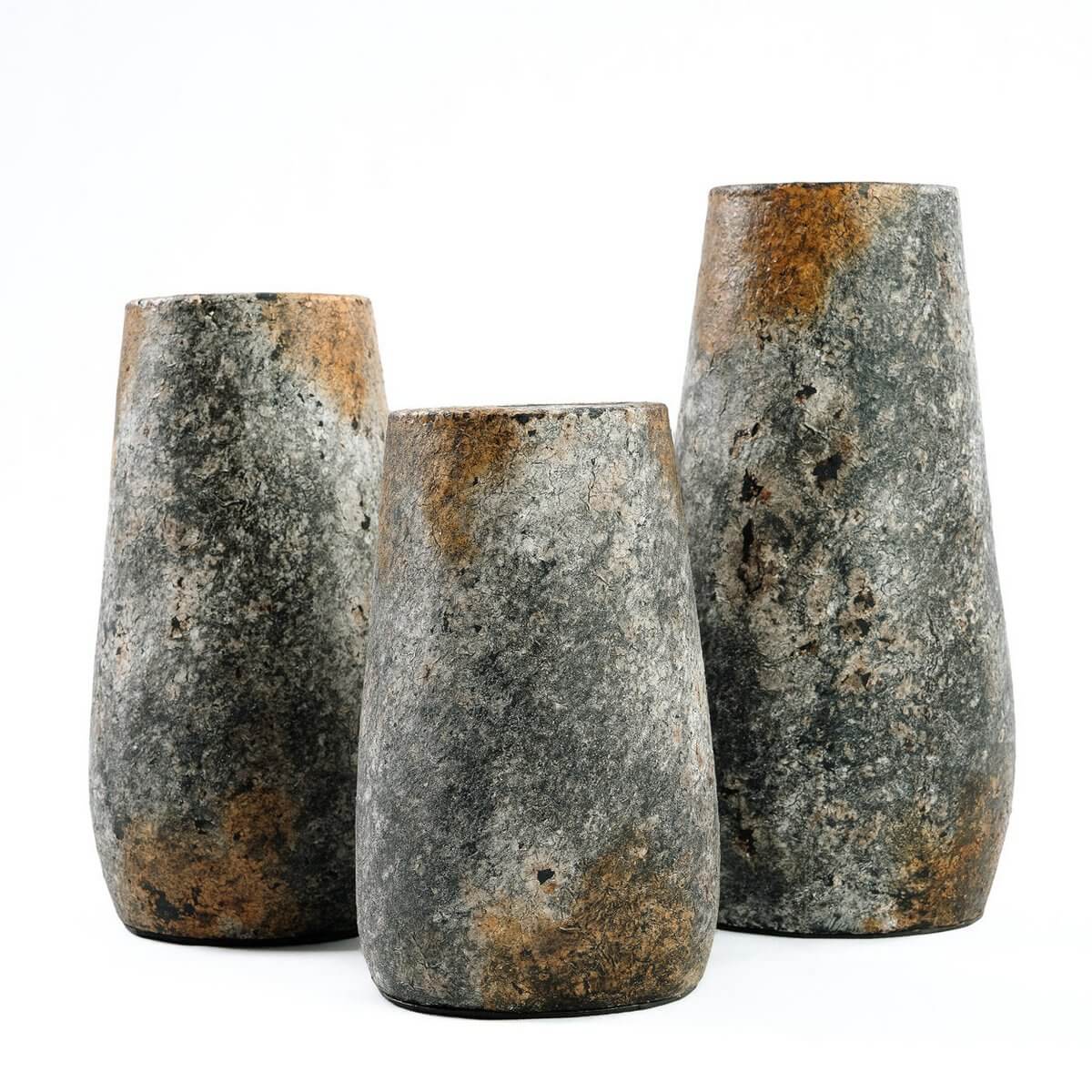Three antique gray terracotta vases with a bohemian charm, perfect for dried or fresh flowers in a living room or bathroom.