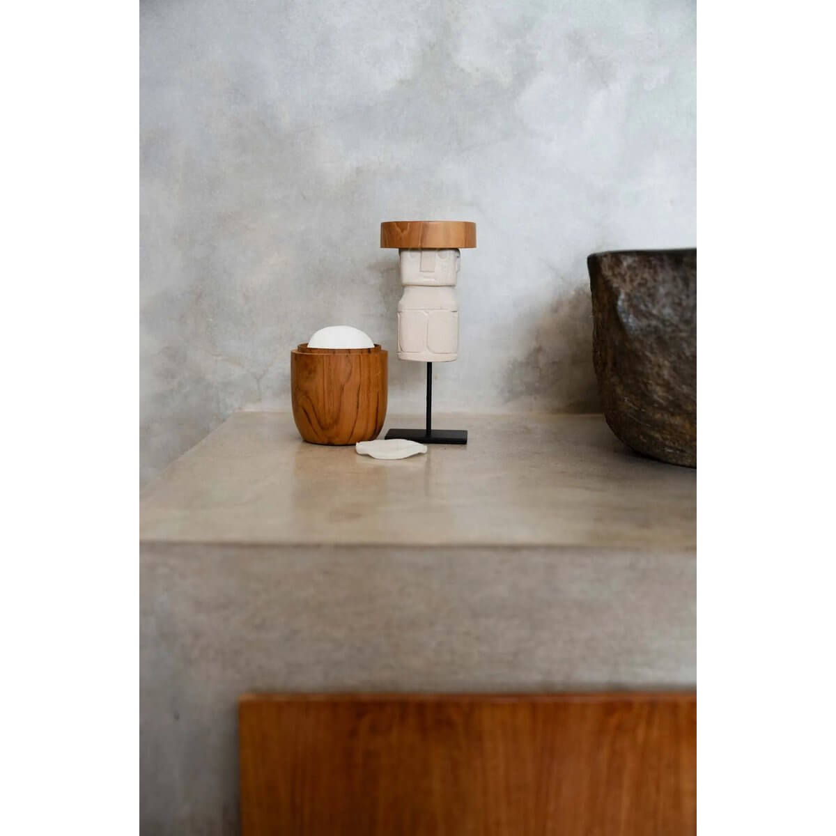 Bohemian style Sumba stone figure on stand, hand-carved vintage decor from Indonesia, perfect for tribal home interior.