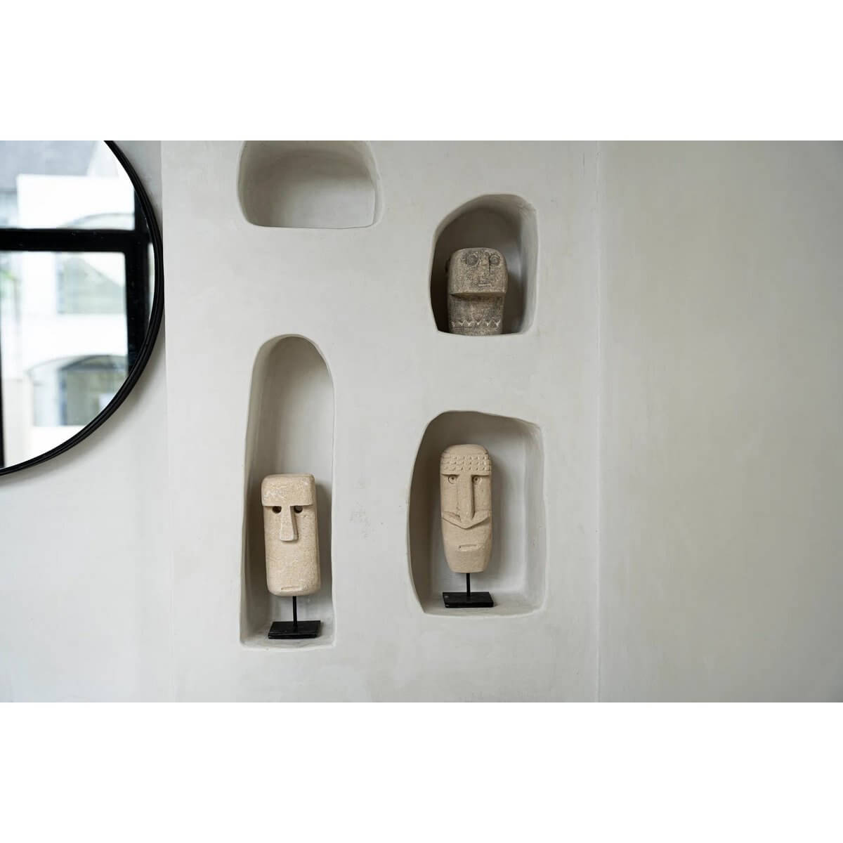 Bohemian Sumba stone statues on display, hand-carved from sandstone, showcasing traditional Indonesian craftsmanship.