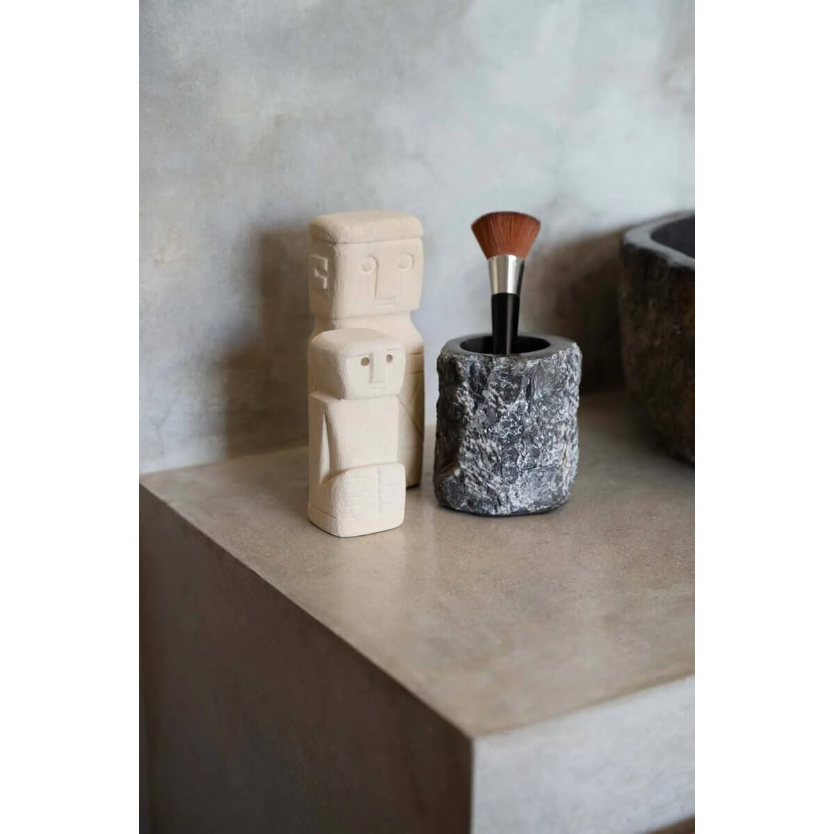 Bohemian Sumba sandstone statue with rustic brush holder, hand-carved in Indonesia, perfect for home decor and protection.