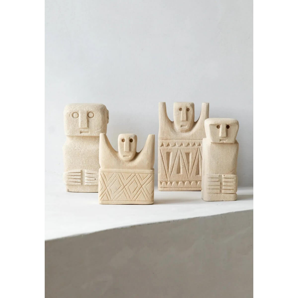 Hand-carved Sumba stone statues from Indonesia, featuring unique Bohemian designs for protective and healing home decor.