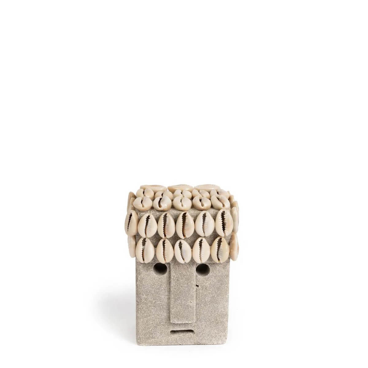 Hand-carved Sumba stone statue with shell accents, offering bohemian charm and traditional Indonesian protection, ideal for decor.