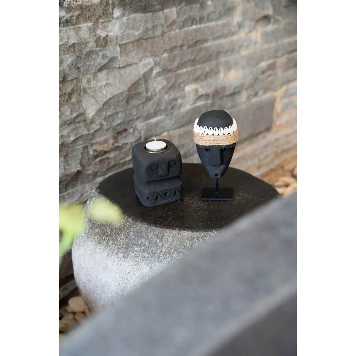 Bohemian De Sumba-steen #35 on stand from Sumba, Indonesia, hand-carved sandstone, protective traditional art, rustic elegance. 