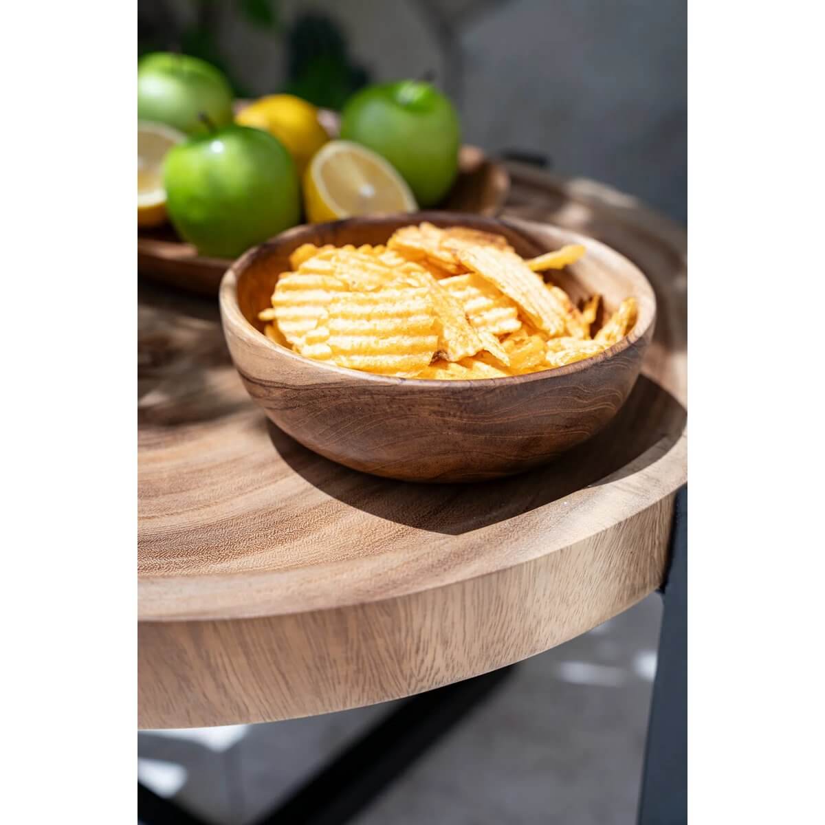 Bohemian Teak Root Snack Bowl filled with chips on a rustic table, showcasing sustainable natural wood elegance.