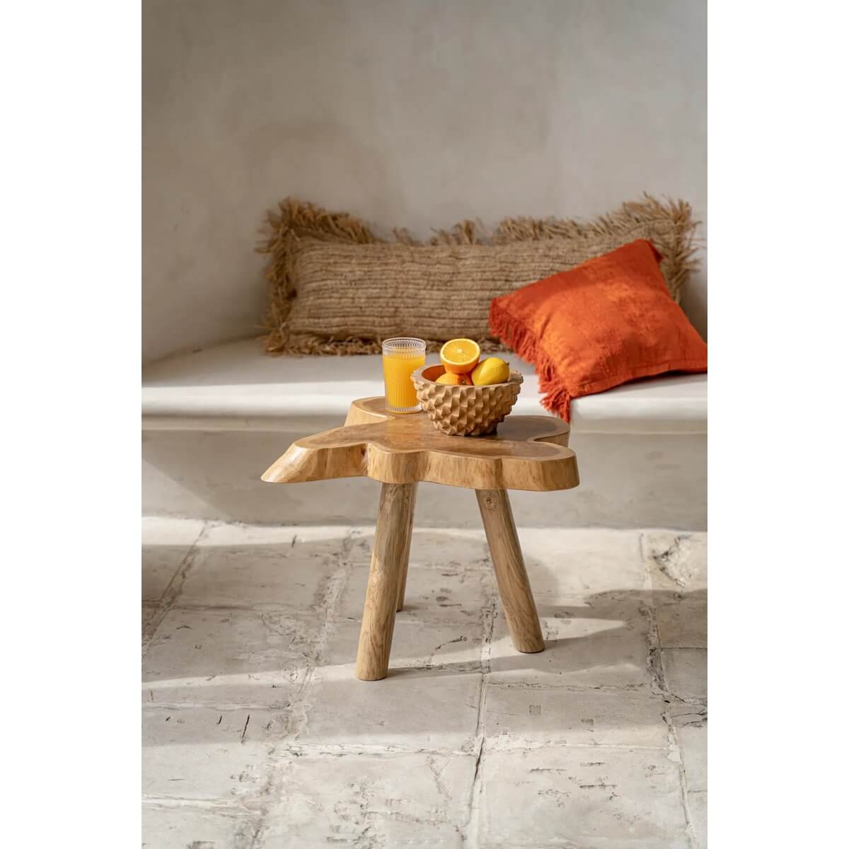 Bohemian Durian Bowl on rustic wooden table with cushions, inspired by the spiky durian fruit, perfect for serving or as a decorative centerpiece.
