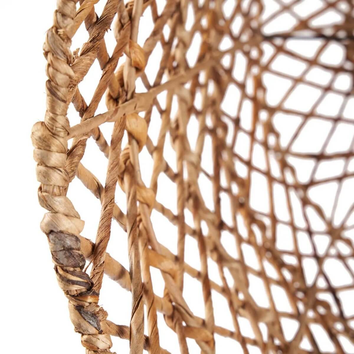 Close-up of the De Xiomara Bohemian hanger made from textured banana leaf, showcasing intricate natural weave.