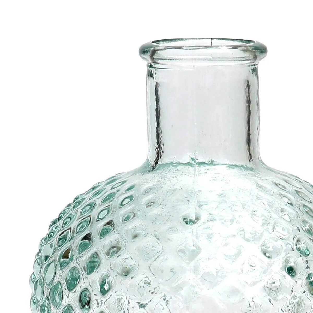 Textured clear glass bottle with a sleek neck, perfect for Bohemian decor.