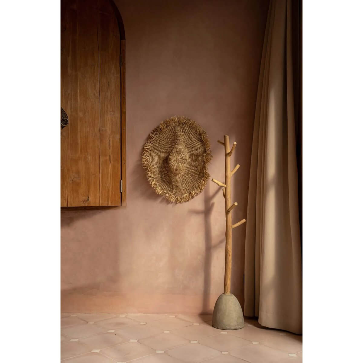 Bohemian style concrete and teak wood coat hanger in a cozy room, blending rustic charm with modern design elegance.