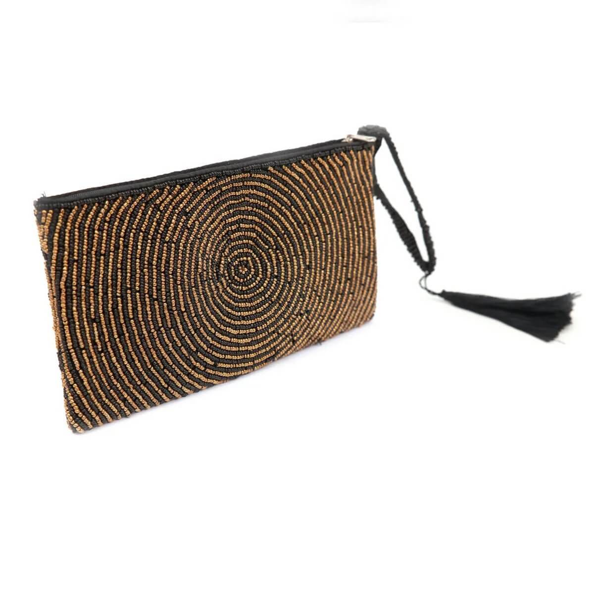 Stylish bohemian golden clutch with intricate circular bead pattern and tassel, perfect for storing essentials like phone and makeup.