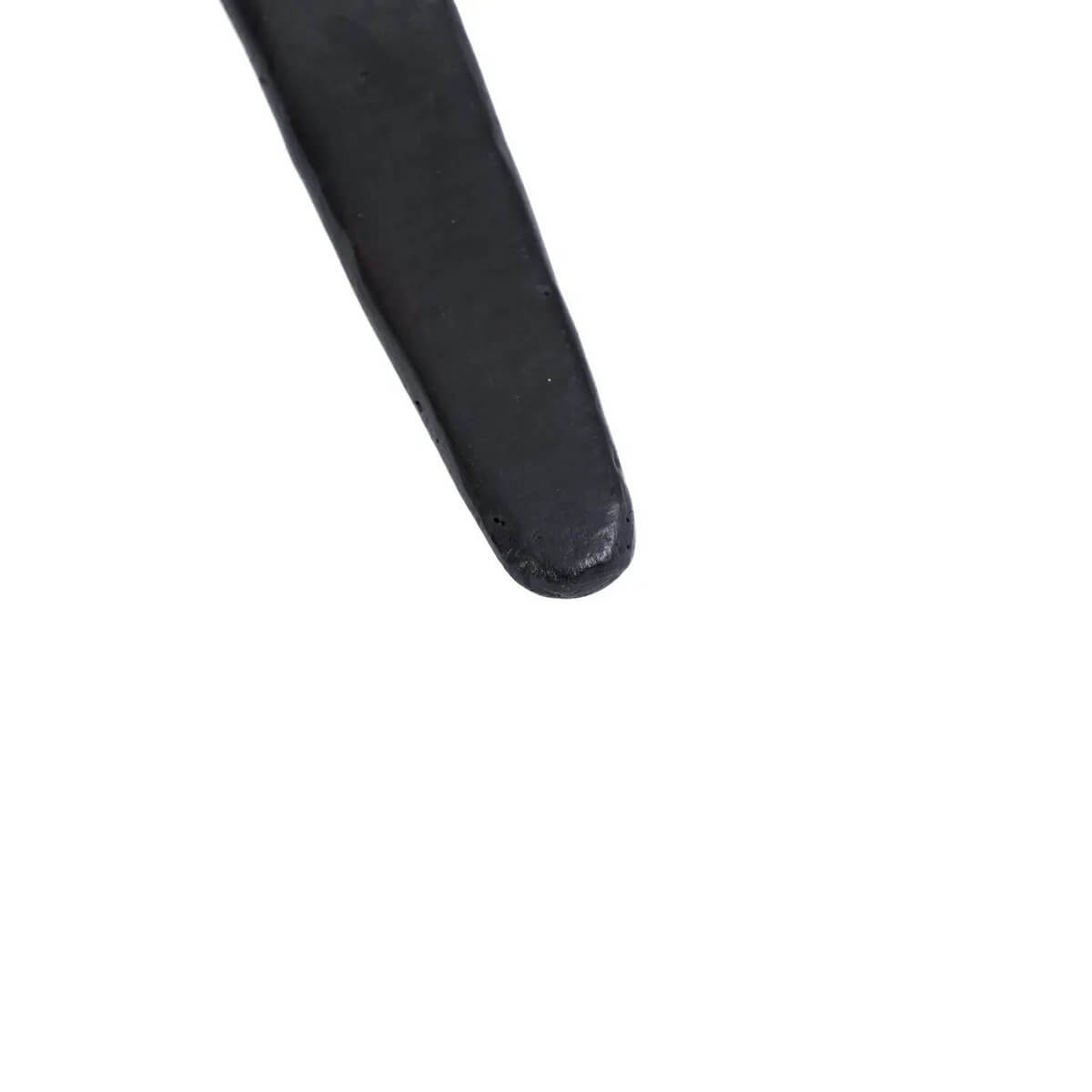Close-up of the black-burnt Bohemian tapas spoon from the Burned collection, perfect for enhancing colorful meals.