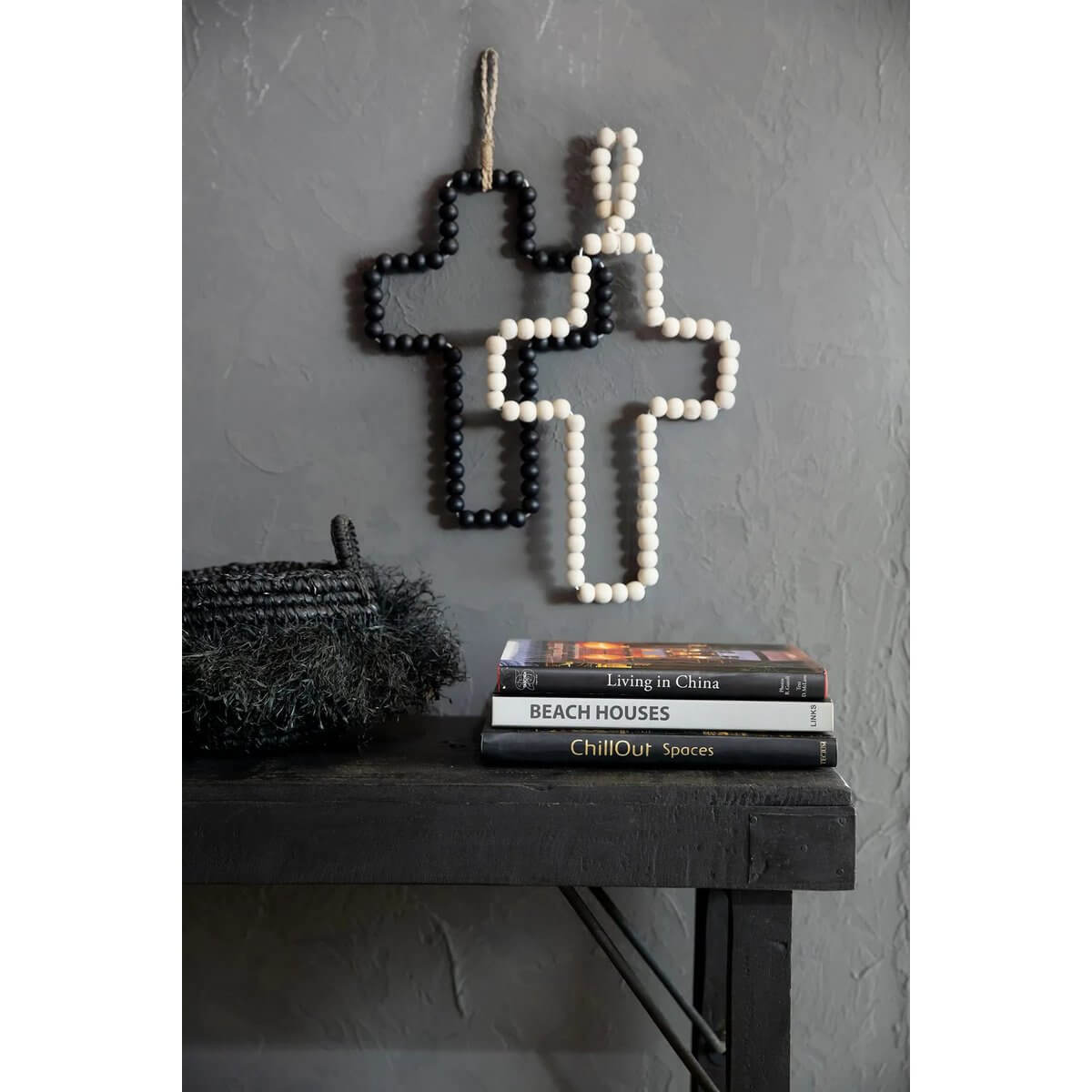 Bohemian style black wooden bead cross by Bazar Bizar Living, perfect for home decor; symbolizes elegance and spirituality.