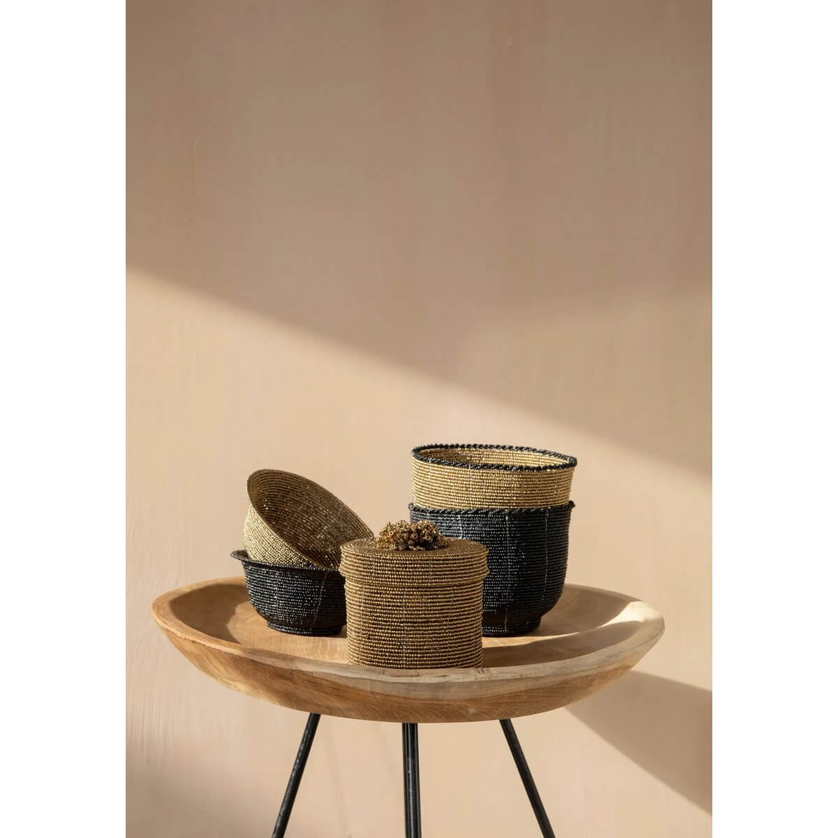 Bohemian style beaded candy bowls in black and gold on a wooden stand, perfect for chic home decor and practical storage.