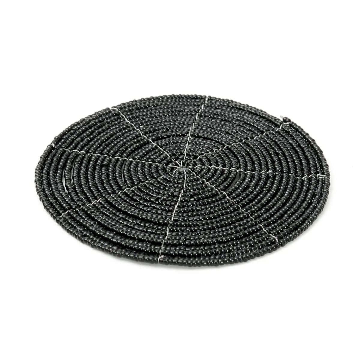 Bohemian black beaded coaster from Bazar Bizar Living, perfect for chic table settings. Diameter: 10cm. Enhance decor with style.