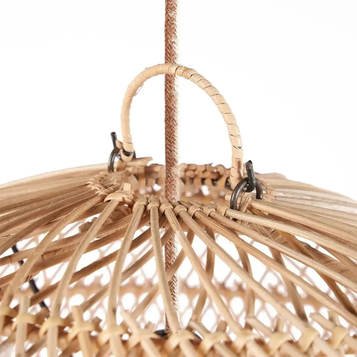 Close-up of The Bubble Hanger's woven rattan detail adding a playful touch to modern or bohemian interiors with a soft glow.