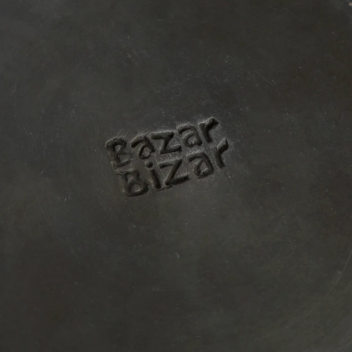 The Burned Classic Plate by Bazar Bizar - black ceramic terracotta dish with a bohemian touch, perfect for stylish dining setups.